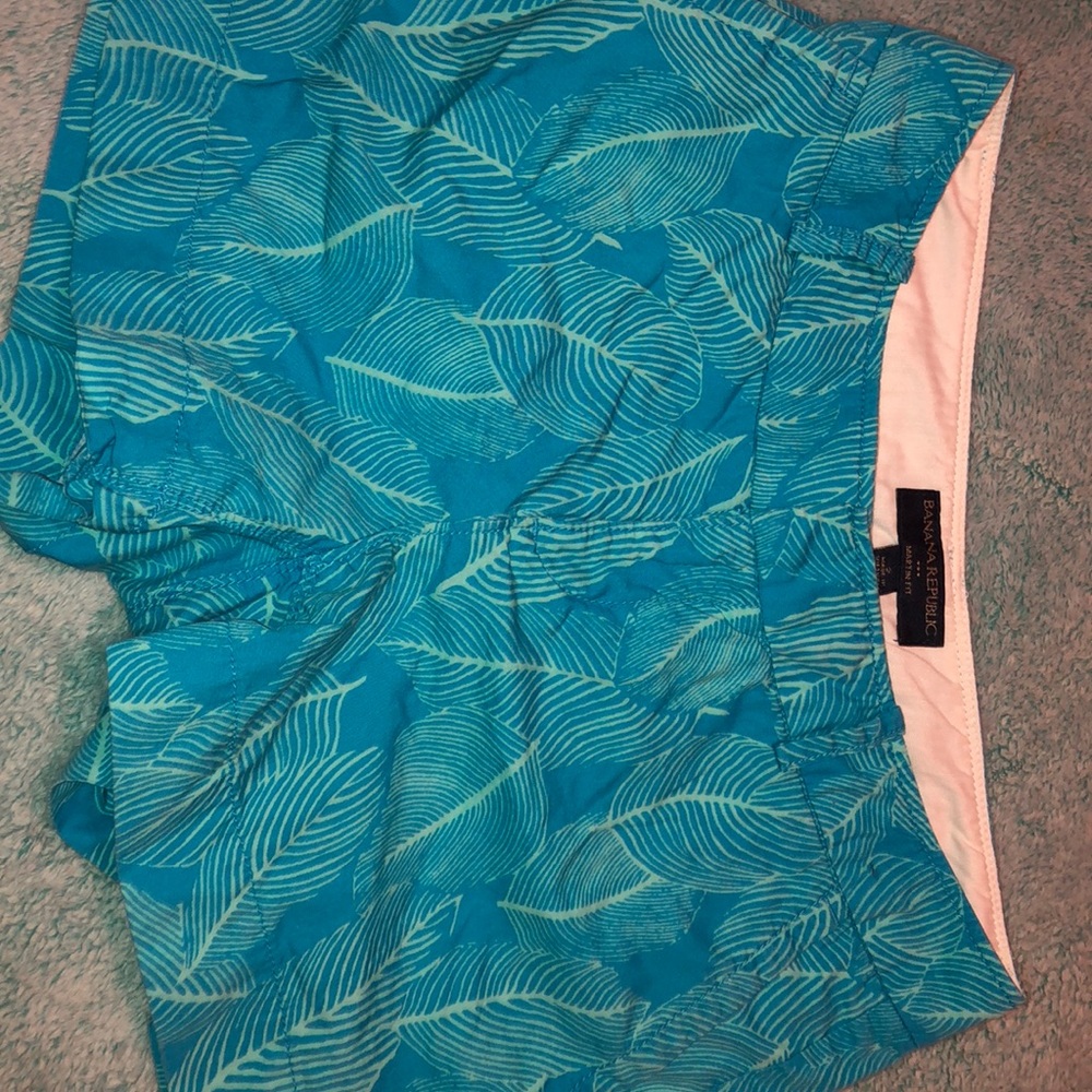 blue shorts with green leaves